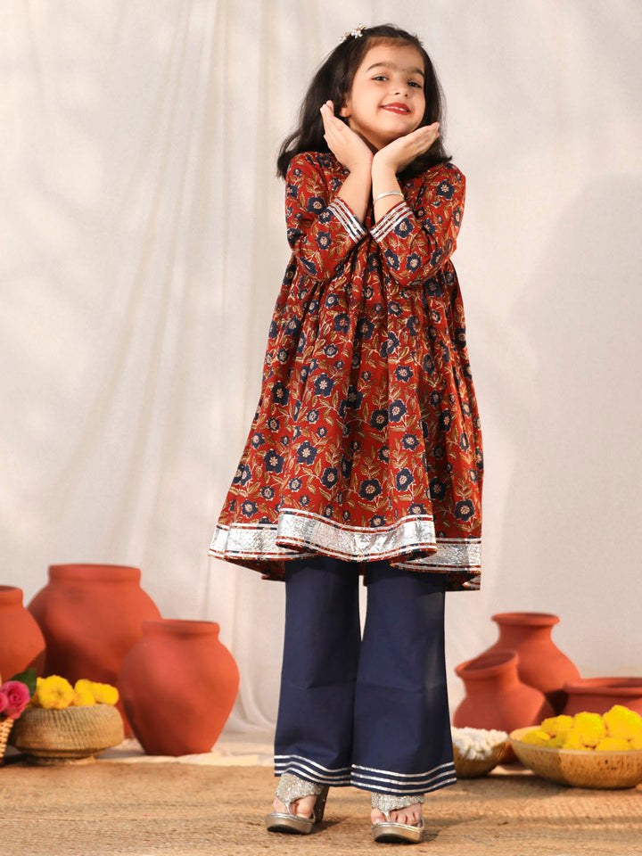 VASTRAMAY Girls' Rust And Navy Blue Flared Kurta Palazzo Set - Traditional Indian outfit with rust and navy blue colors, perfect for girls' special occasions and celebrations