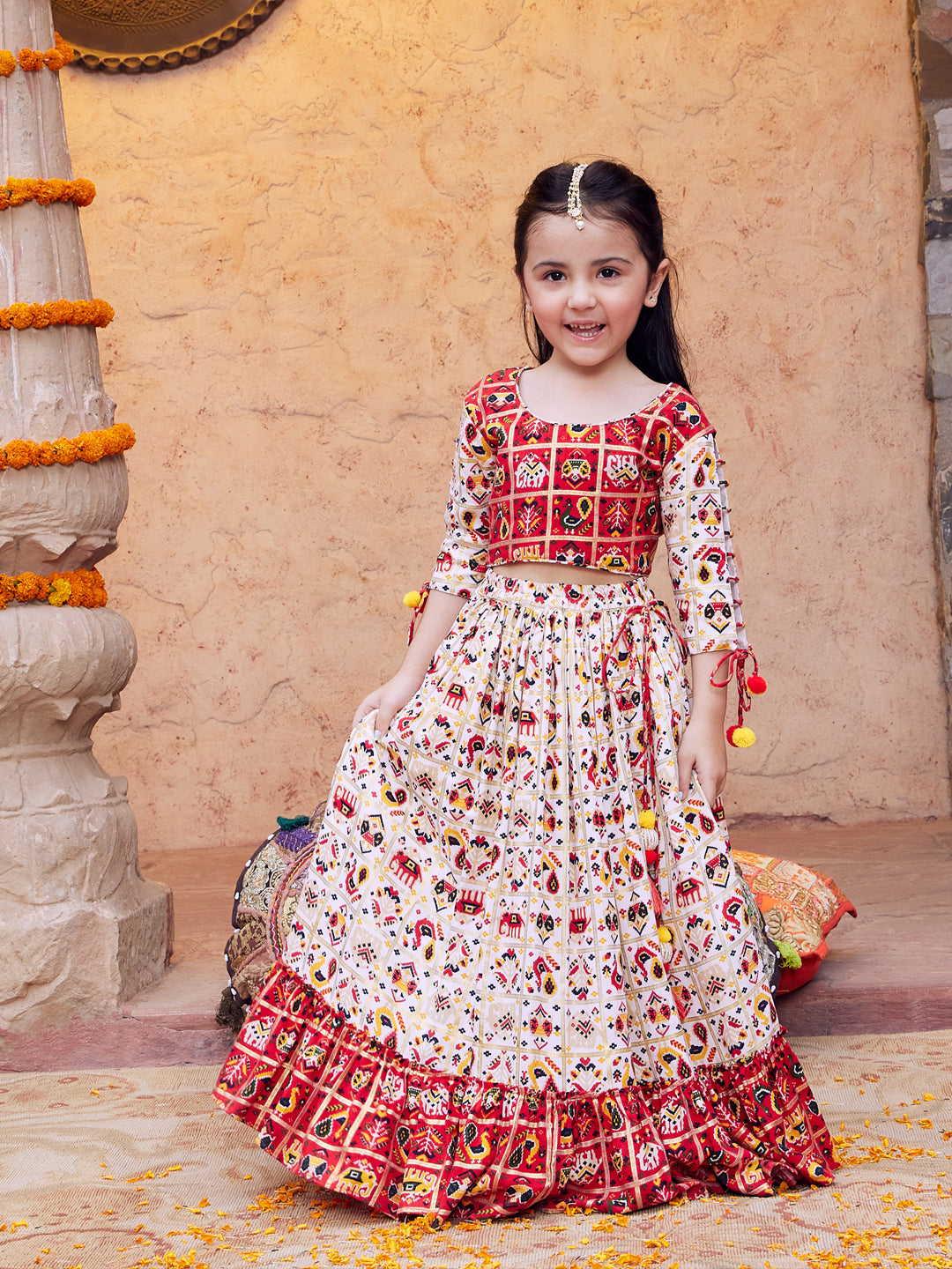 VASTRAMAY Girls' Red And Cream Patola Print Lehenga Set