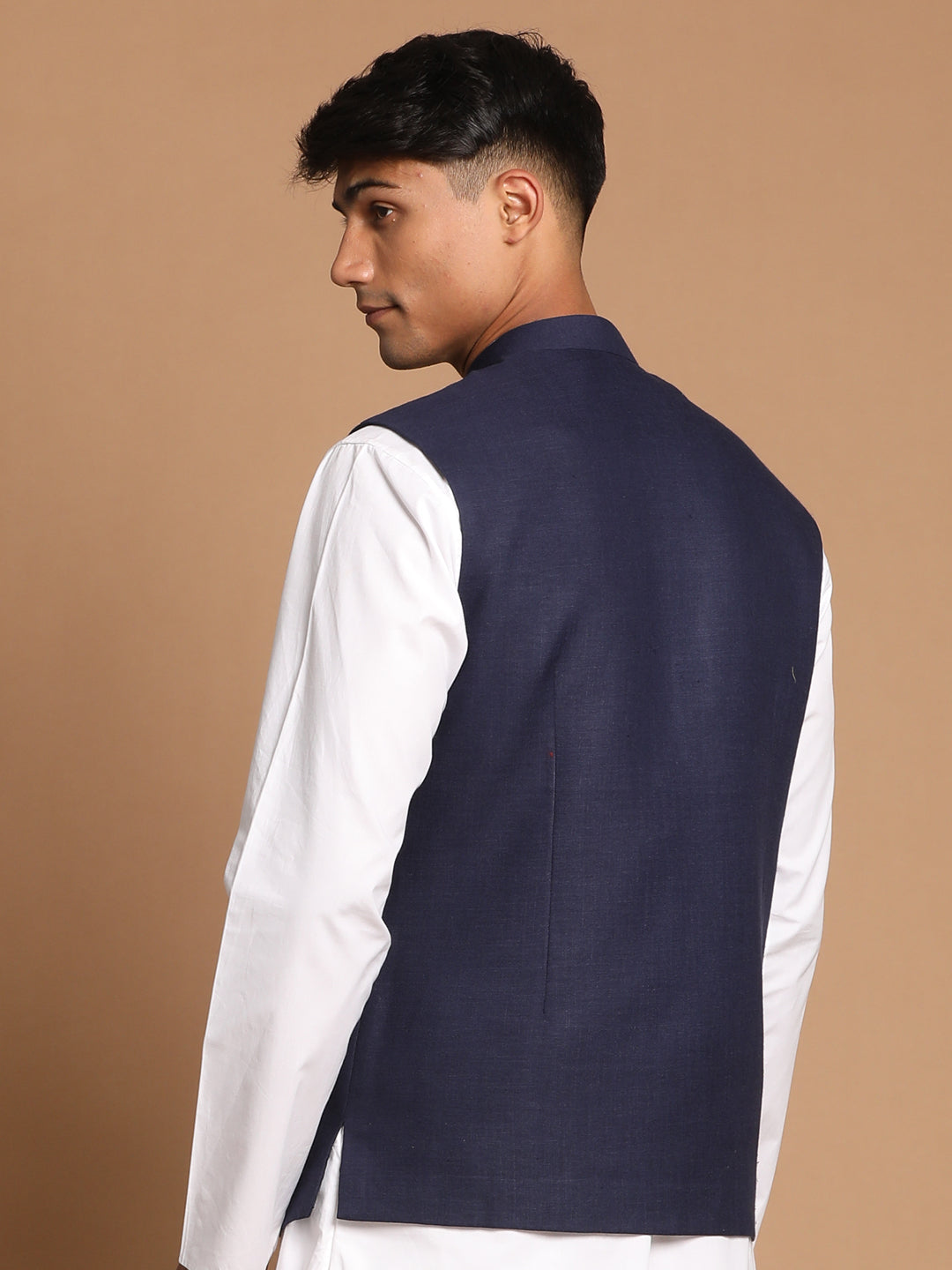  Side view of VASTRAMAY Navy Blue Cotton Blend Nehru Jacket displaying its tailored fit and sleek design