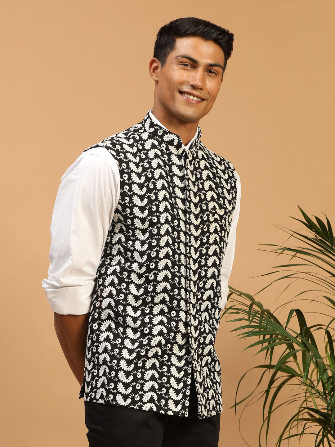 Front view of VASTRAMAY Black Chikankari Cotton Nehru Jacket with intricate white embroidery on the chest and pockets