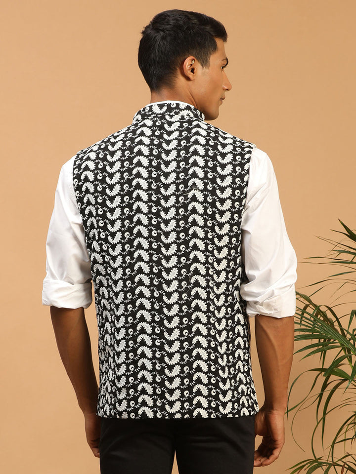  
VASTRAMAY Men Black Chikankari Embroidered Pure Cotton Nehru Jacket side view, highlighting the slim fit and high-quality cotton fabric