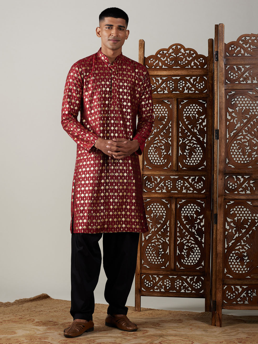 Vibrant maroon kurta with intricate foil print paired with stylish black Patiala set for men by VASTRAMAY