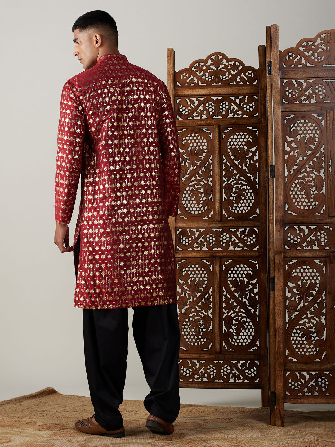 Close-up of the maroon foil printed kurta, showing intricate details and craftsmanship