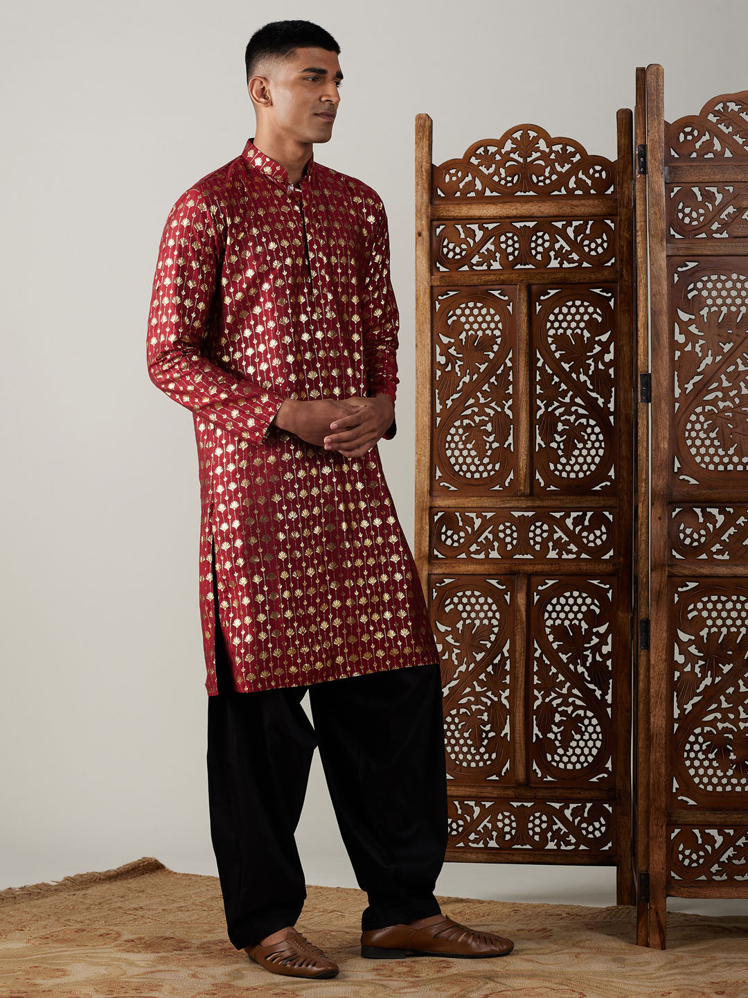 VASTRAMAY Men's Maroon Foil Printed Kurta With Black Patiala Set kurta and patiala set displayed on a mannequin in a stylish setting