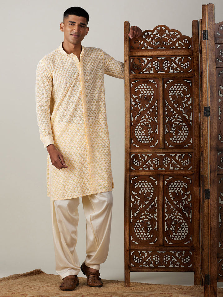 Front open kurta with intricate chikankari detailing paired with patiala