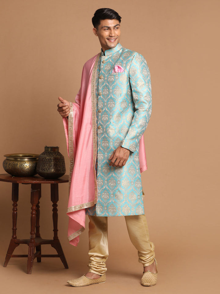 Sea green and gold brocade jacquard sherwani set with pink dupatta on mannequin