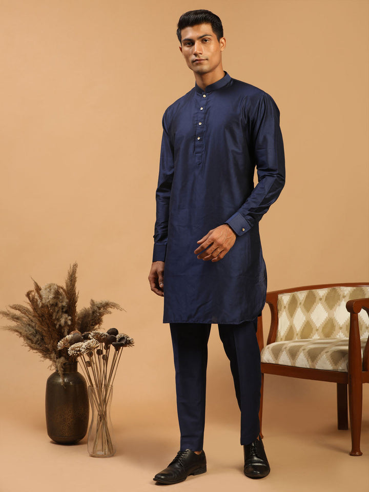 VASTRAMAY Men's Blue Silk Blend Kurta with Pant Set, featuring a stylish curved hem and intricate design