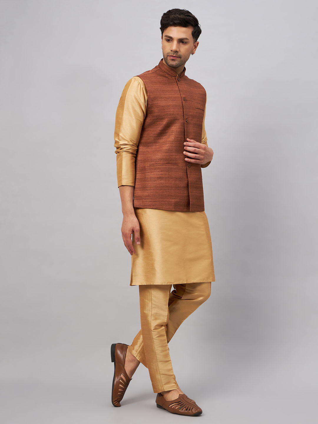  Sophisticated outfit for men featuring a coffee jacket and rose gold kurta 