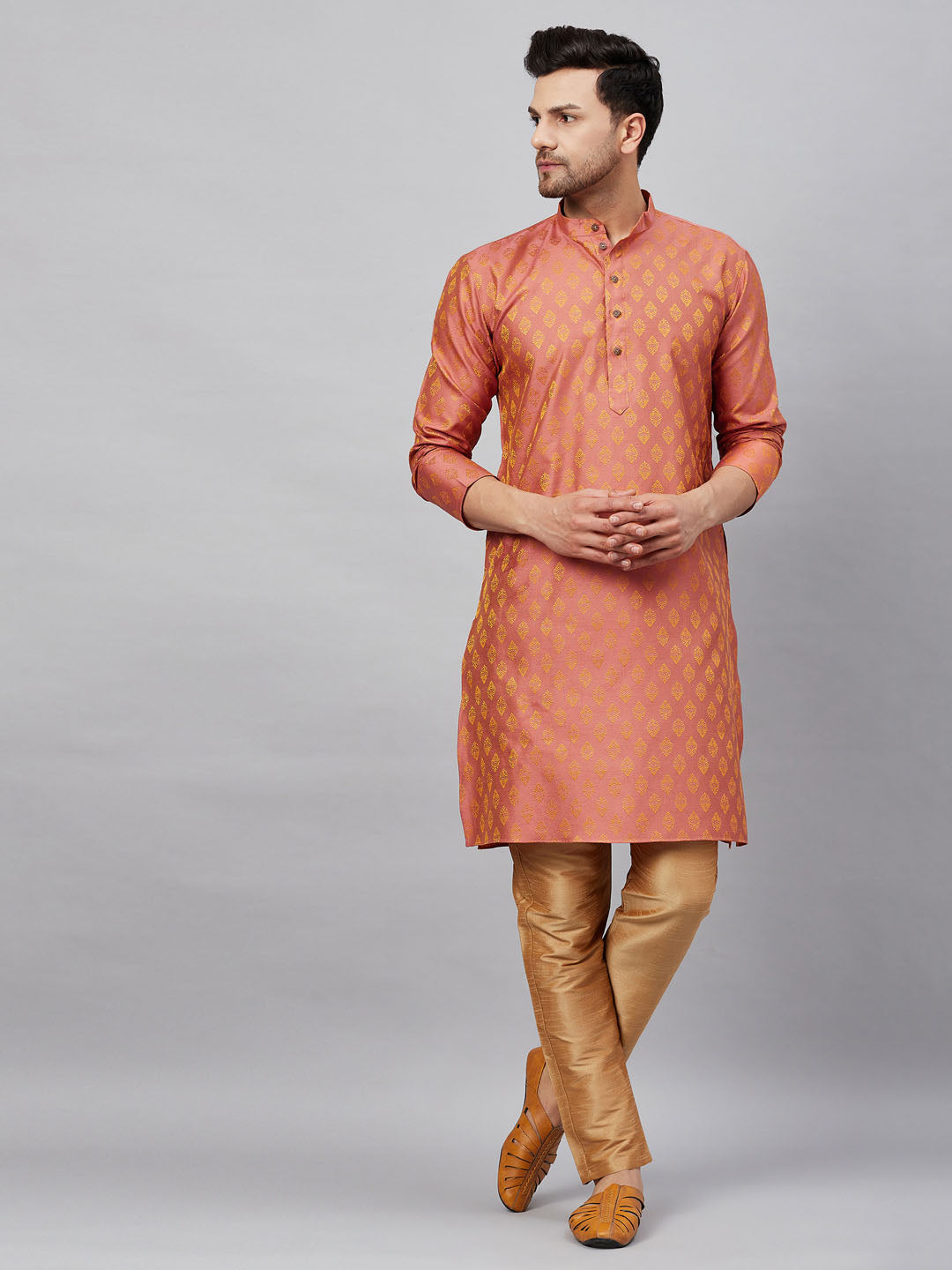 A stylish and elegant VM By VASTRAMAY Men's Pink and Rose Gold Woven Kurta Pant Set with intricate woven detailing perfect for festive occasions and special events