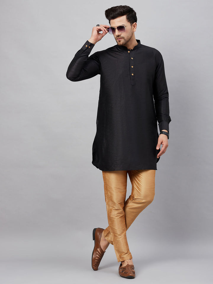  Side view of the black silk blend kurta pant set, highlighting the curved hem and modern silhouette