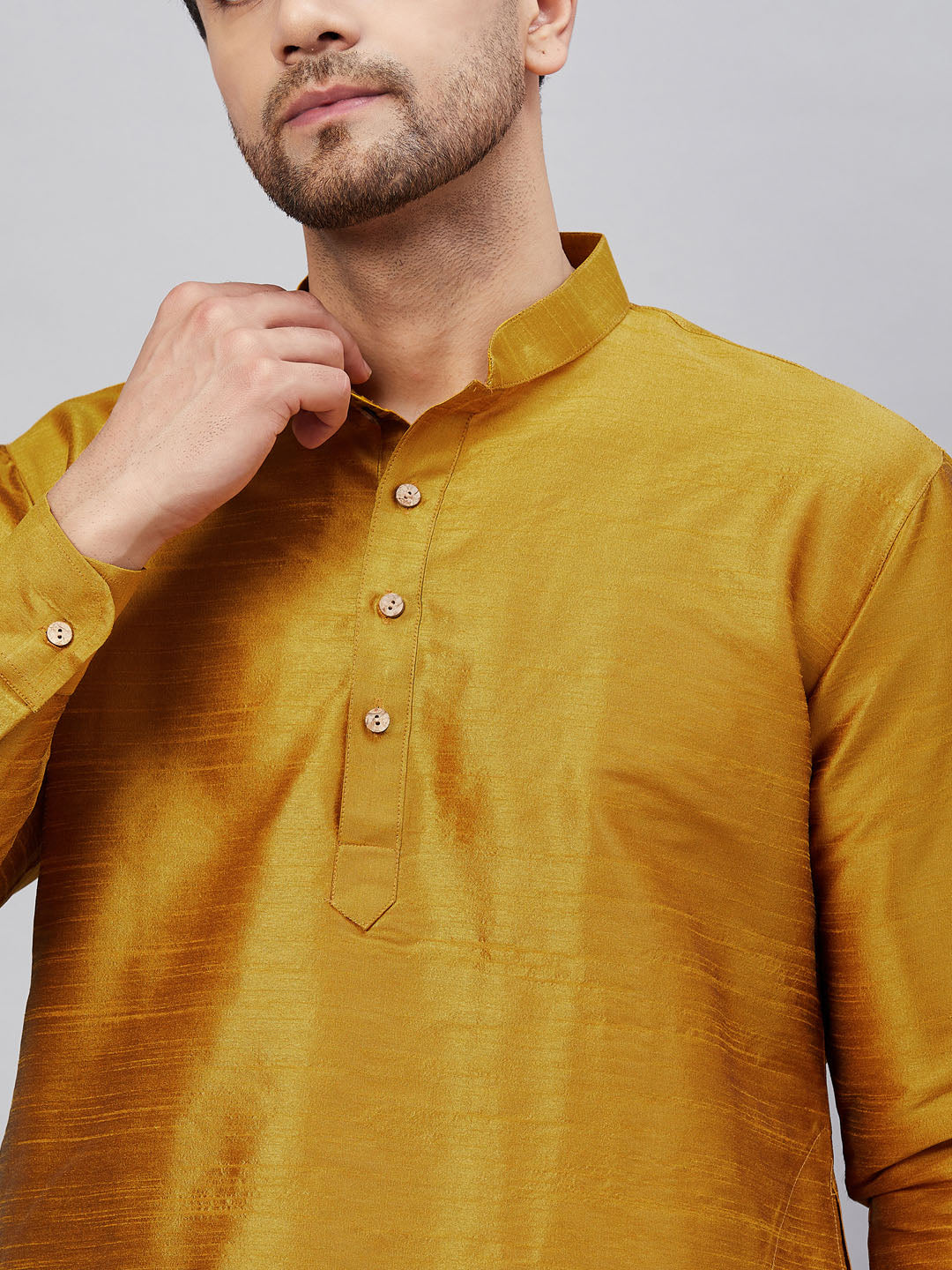 VM By VASTRAMAY Men's Mustard Silk Blend Curved Kurta Pant Set: Traditional Indian ethnic wear for men with a mustard yellow silk blend kurta and matching pants