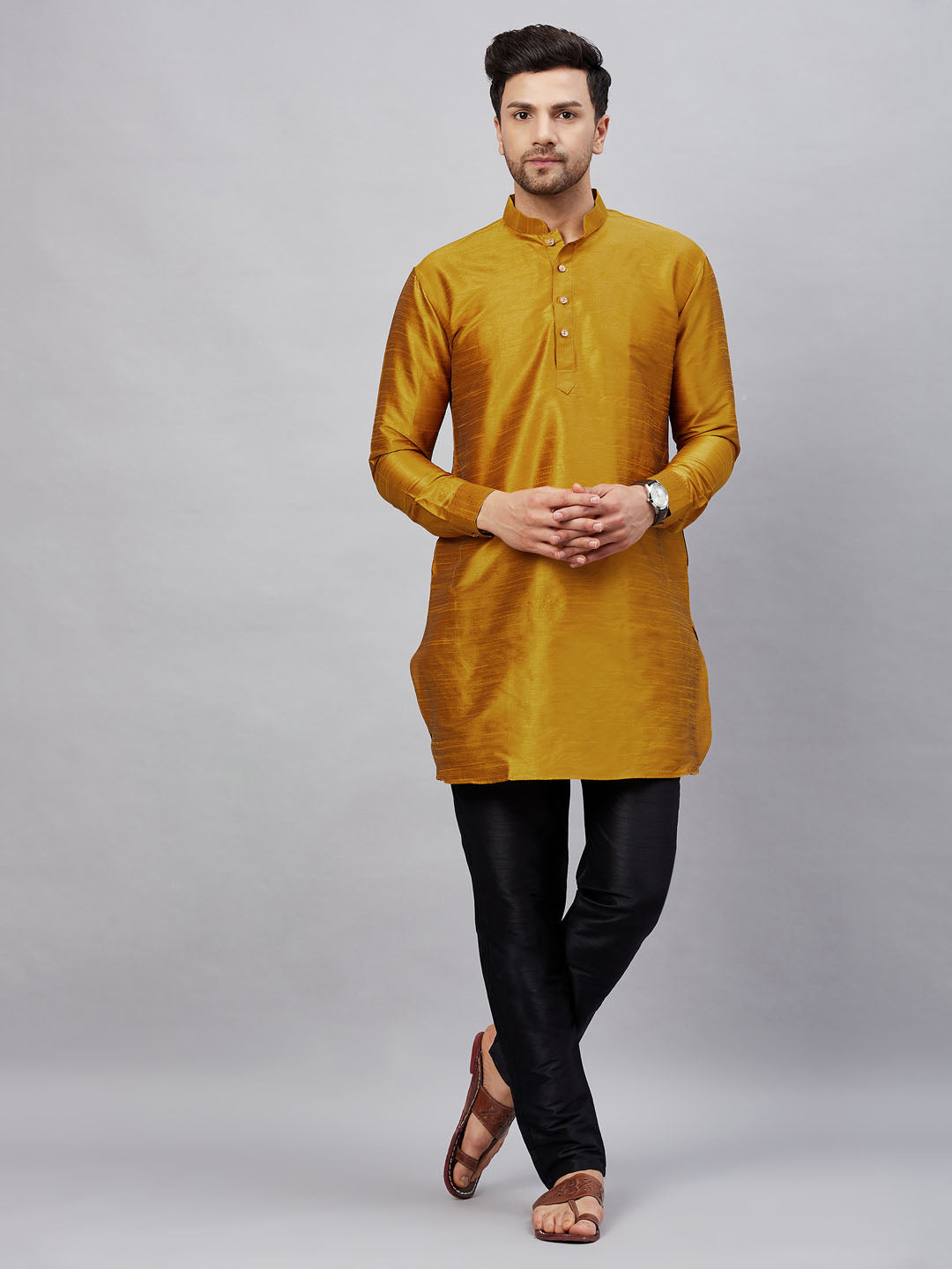 VM By VASTRAMAY Men's Mustard Silk Blend Curved Kurta Pant Set perfect for traditional Indian occasions with its rich silk fabric and stylish design