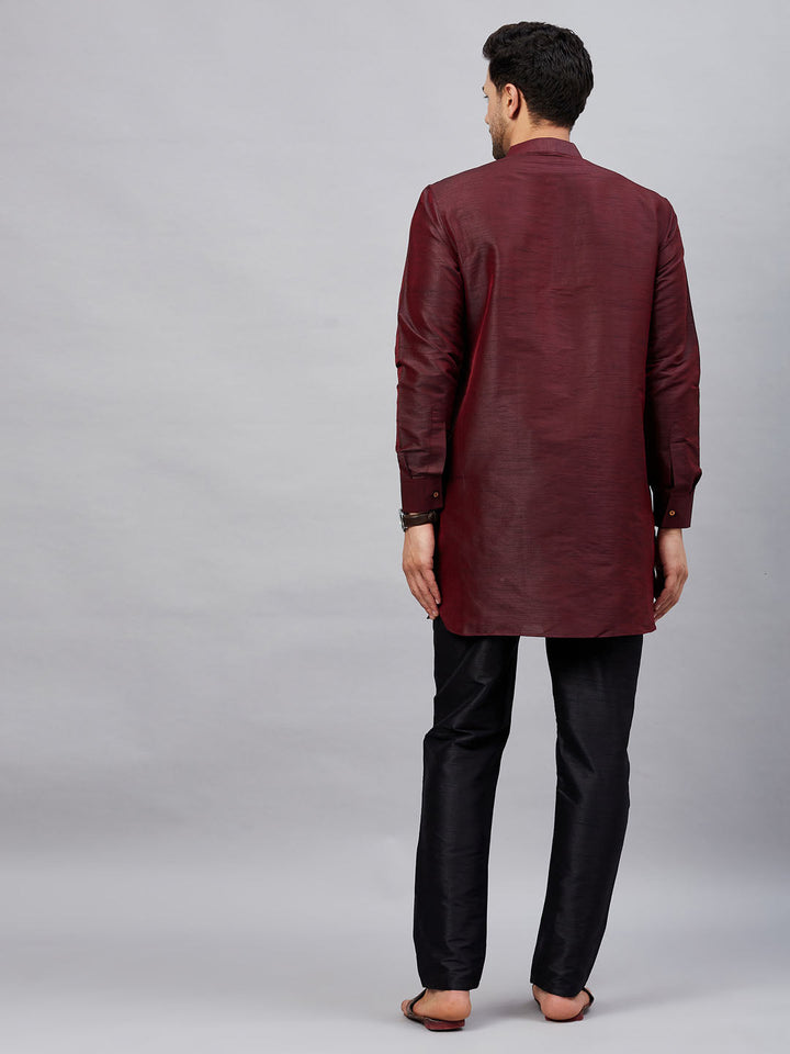 VM By VASTRAMAY Men's Wine Silk Blend Curved Kurta Pant Set with intricate embroidery on the chest and sleeves, paired with matching straight-fit pants