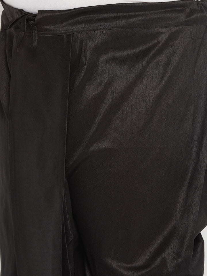  A group of men wearing the VASTRAMAY Men's Plus Size Black Cotton Blend Solid Traditional Dhoti during a traditional Indian wedding