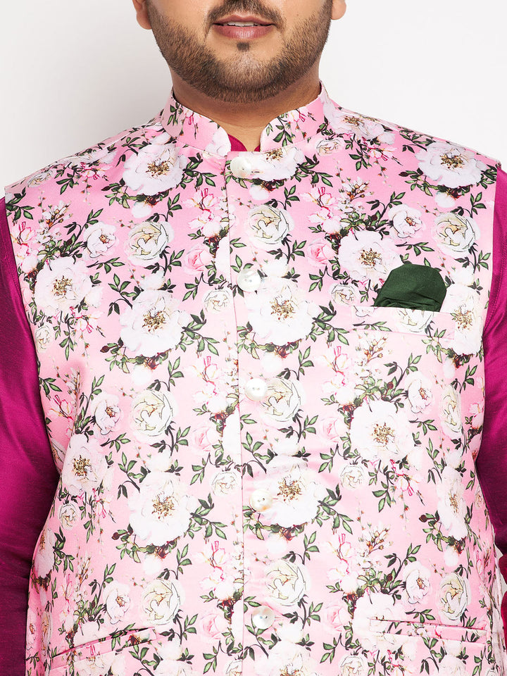 Man standing confidently in the stylish pink floral printed jacket and fuchsia kurta pyjama set