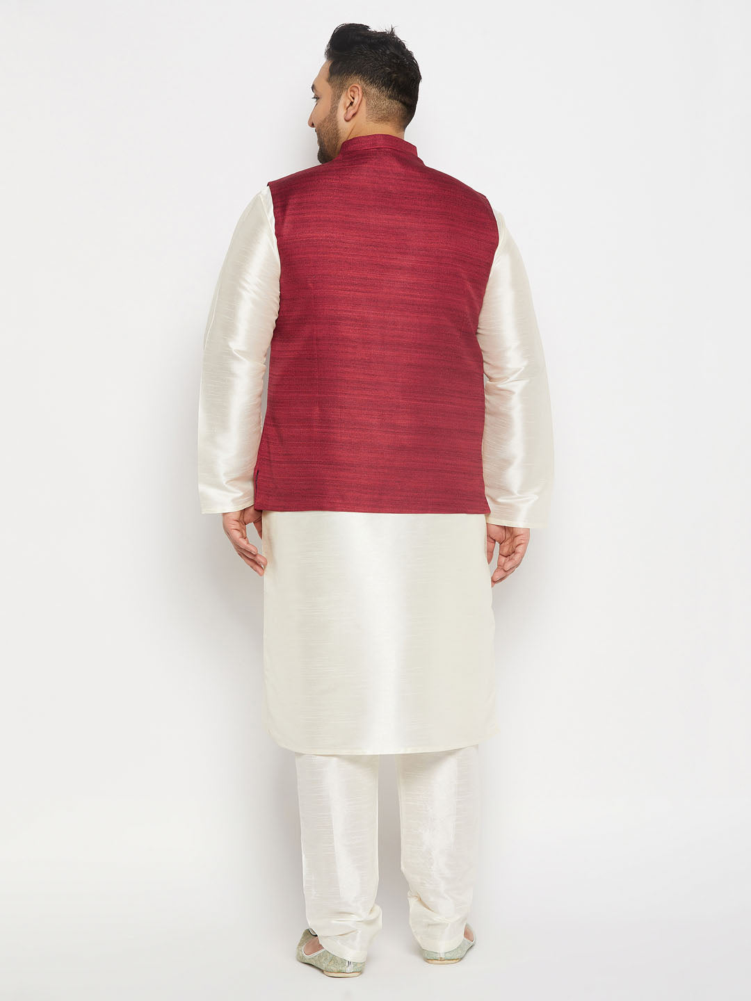 Man wearing VASTRAMAY Maroon Matka Silk Nehru Jacket with Cream Silk Blend Kurta and Pant style Pyjama Set 