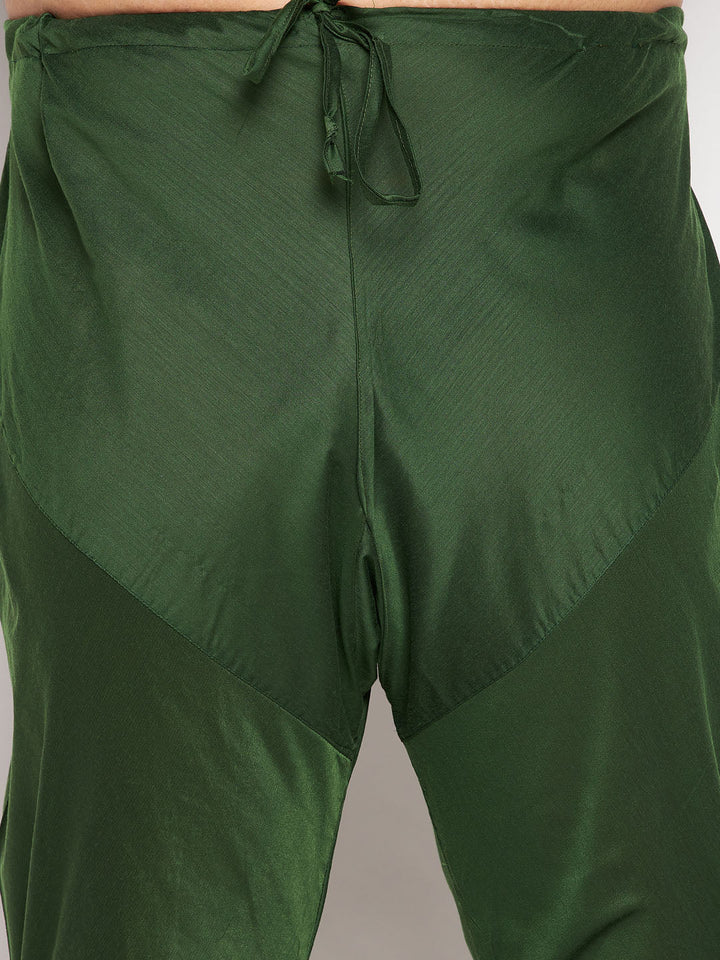  Dark green kurta with decorative buttons paired with pink silk blend Jodhpuri