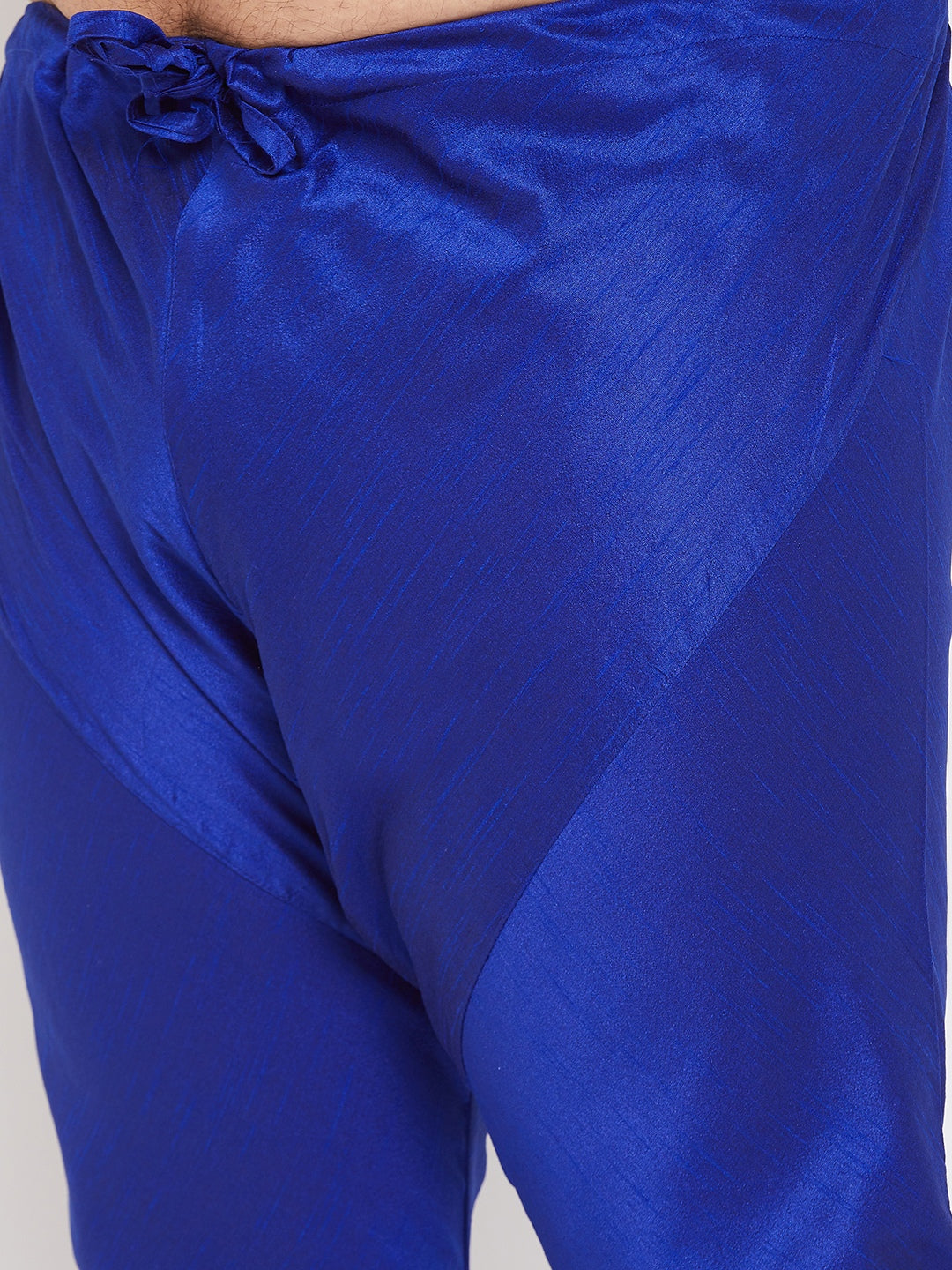 Vibrant blue silk kurta set for men with intricate detailing and traditional design