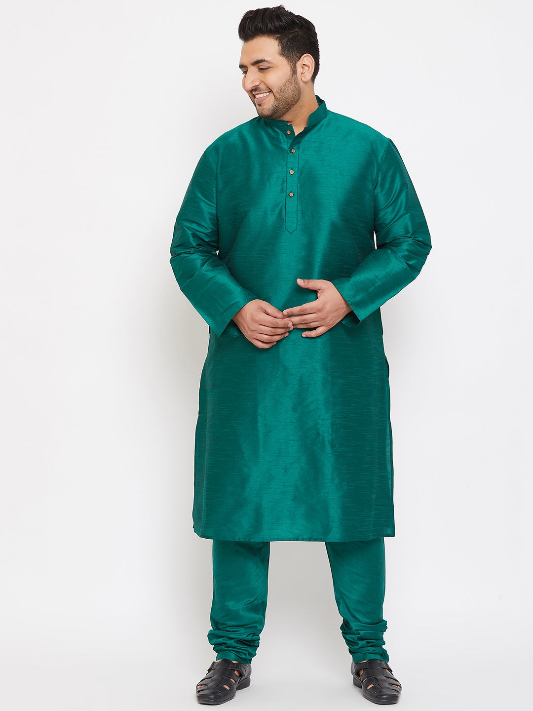  A man walking in the VASTRAMAY Men's Plus Size Green Silk Blend Kurta Pyjama Set, showcasing the comfortable and easy movement of the outfit