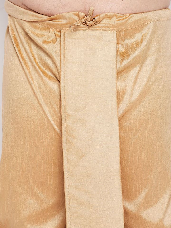  Detailed view of the rose gold dhoti with pleats and border