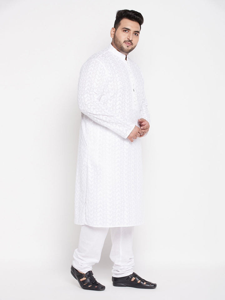 Alt text: VASTRAMAY Men's Plus Size White Chikankari Embroidered Kurta And White Pyjama Set, traditional Indian attire with intricate white embroidery detail