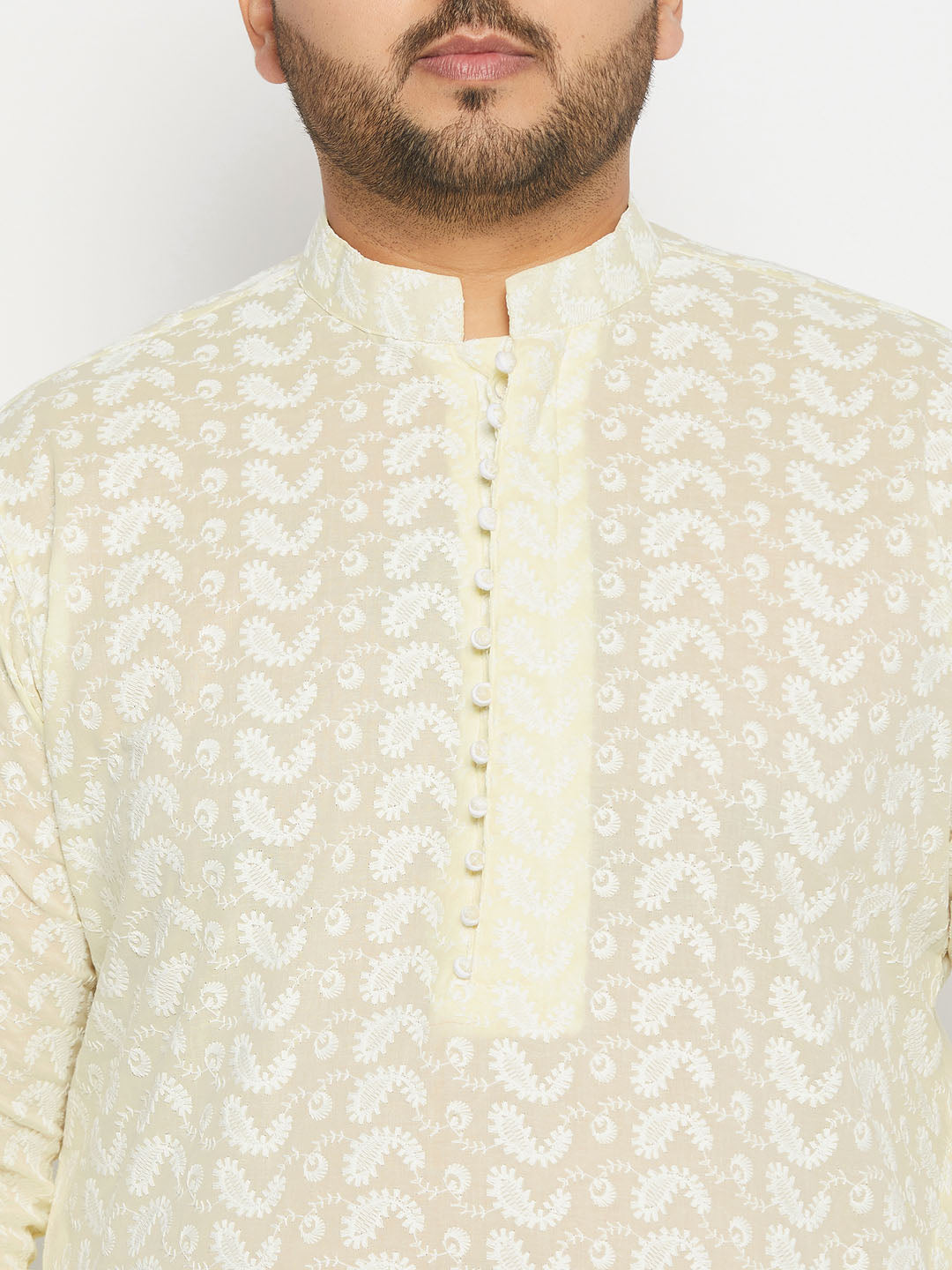 Detailed shot of the white pyjama of VASTRAMAY Men's Plus Size Yellow Chikankari Embroidered Kurta And White Pyjama Set, featuring a relaxed and roomy fit