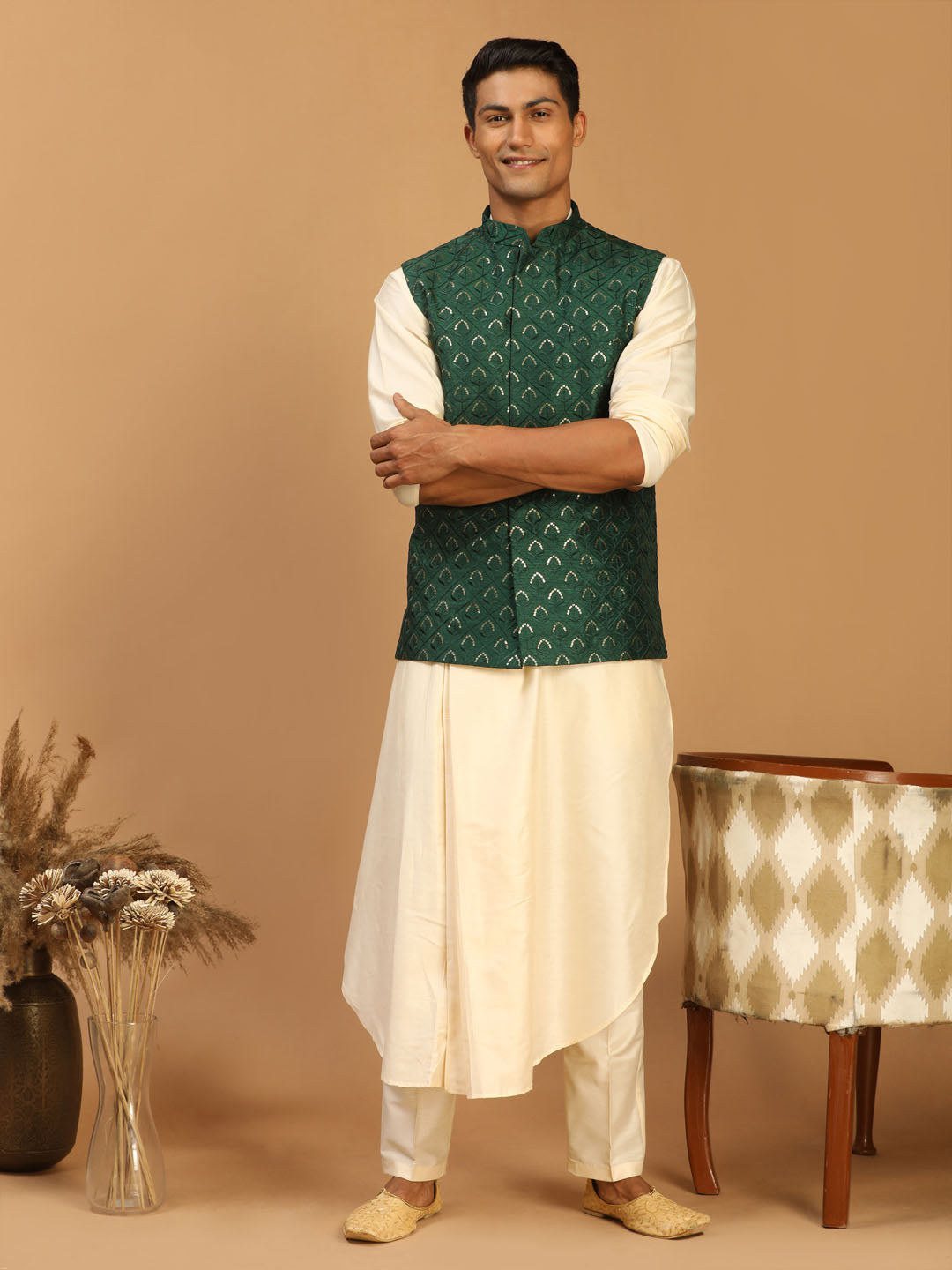 Vibrant green embellished jacket paired with cream pleated kurta pant set for men