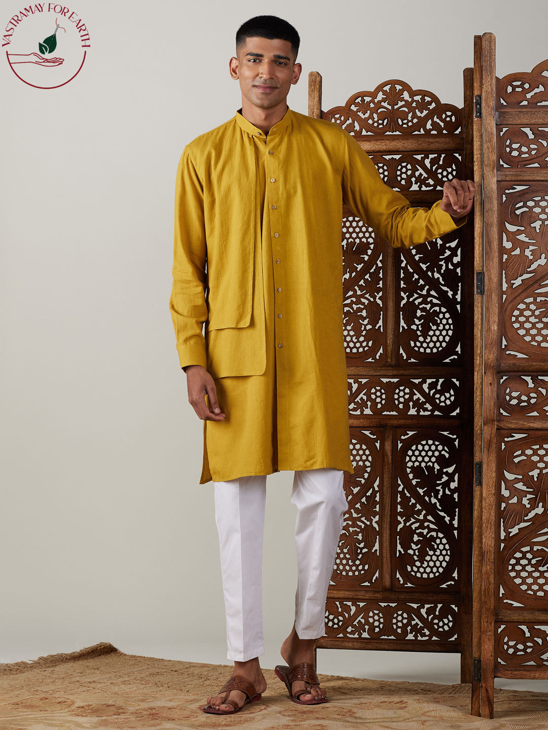 Ethnic Indian outfit for men in mustard color with intricate embroidery and comfortable white pants