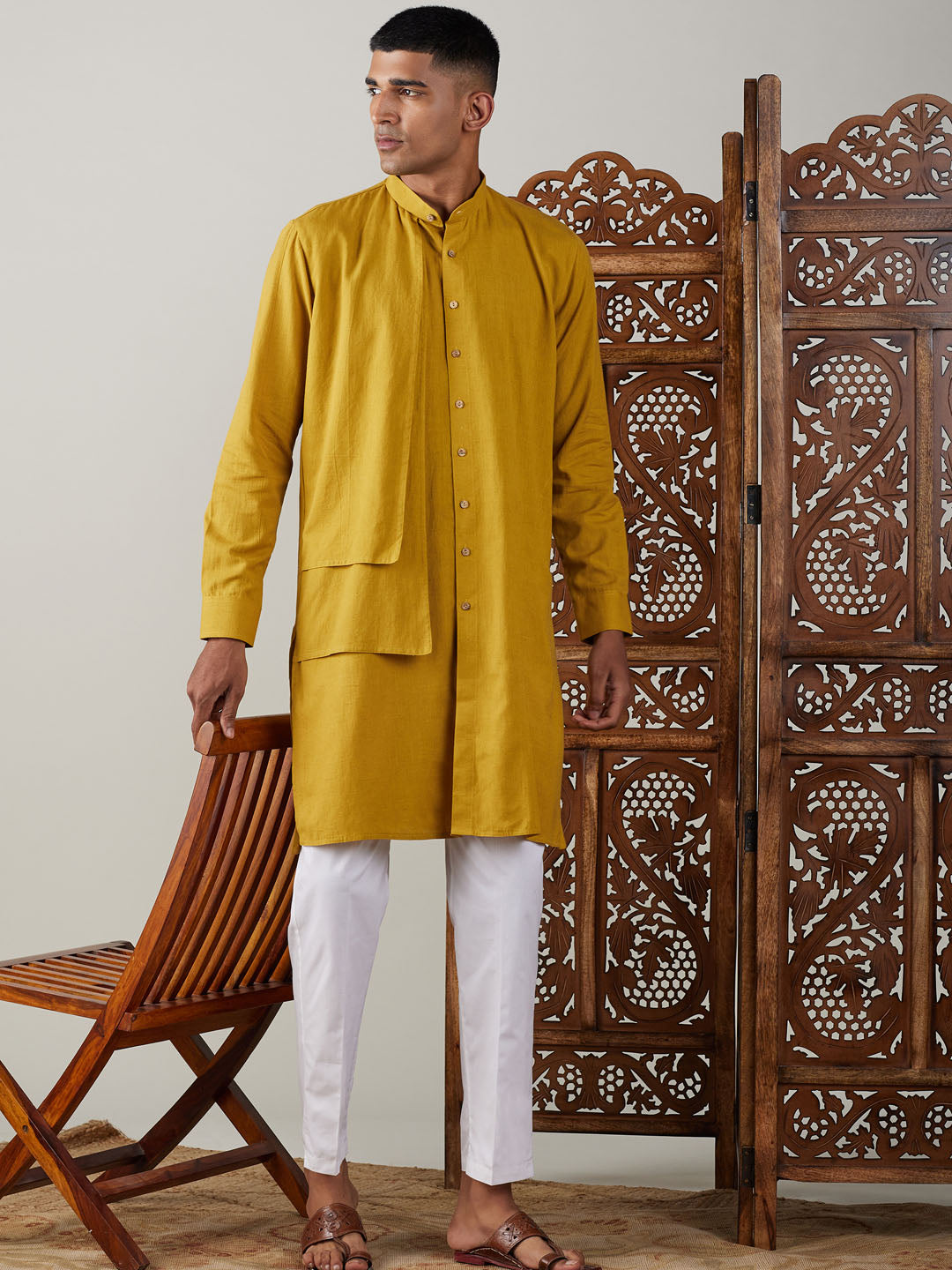 Men's mustard colored cotton kurta with white pants set for a stylish and comfortable look