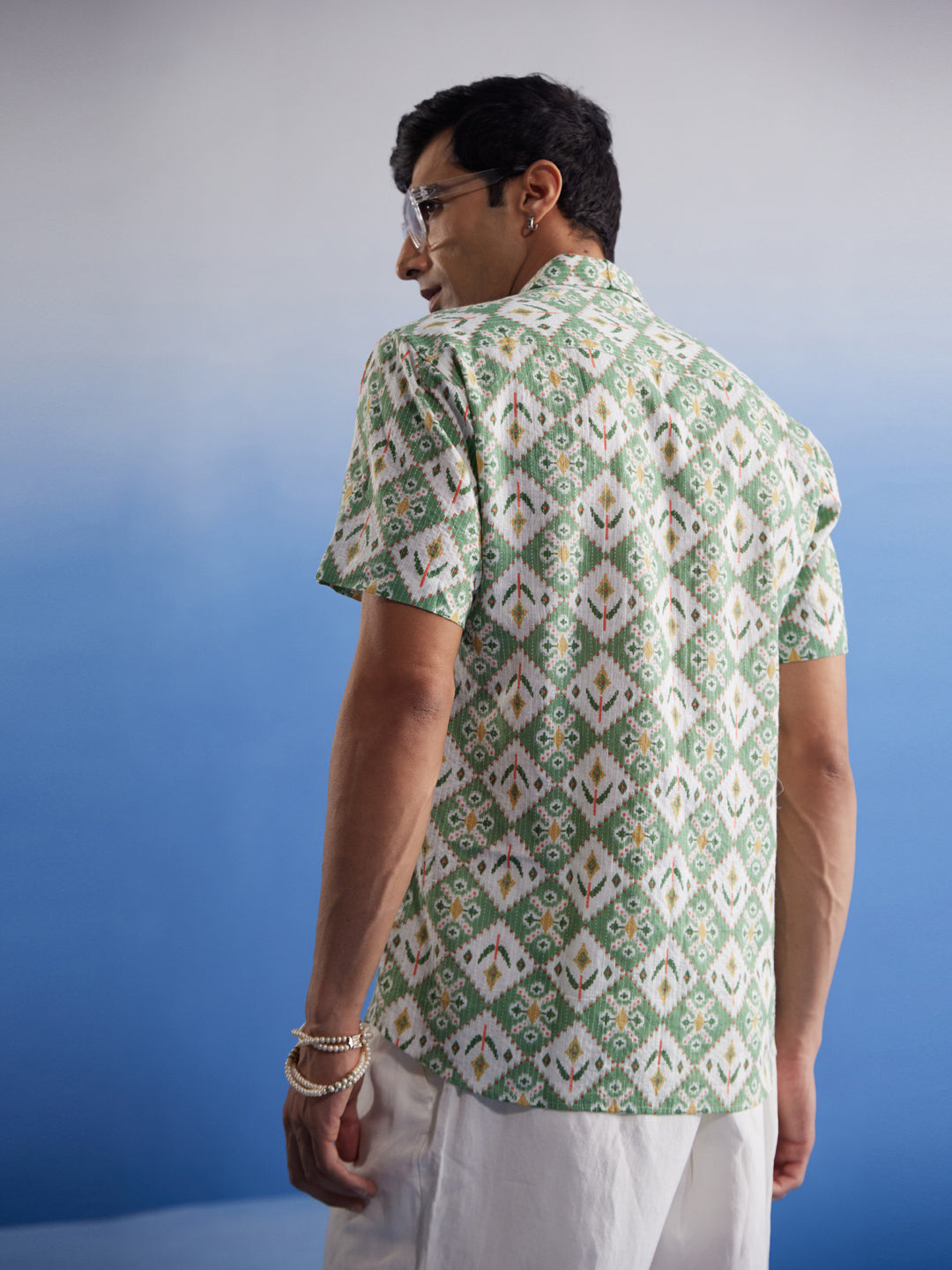  Front view of Vastramay Men's Green Ikkat Print Cotton Shirt made of high-quality cotton fabric