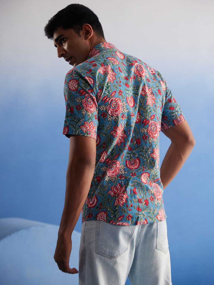  Vastramay Men's Aqua Kalamkari Cotton Shirt folded neatly with emphasis on the vibrant aqua color