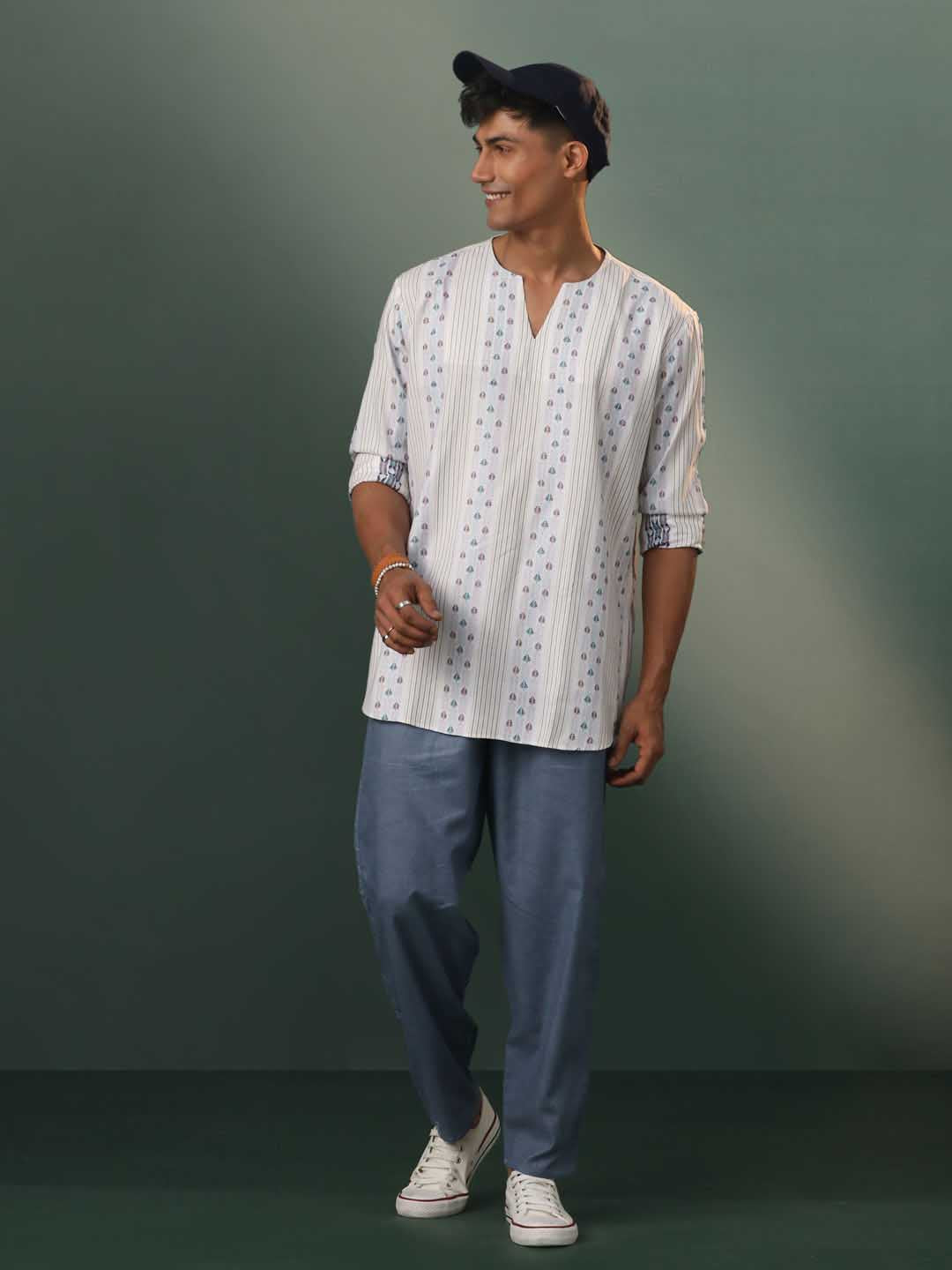 Traditional Indian men's kurta in off-white with geometric weaves and short length