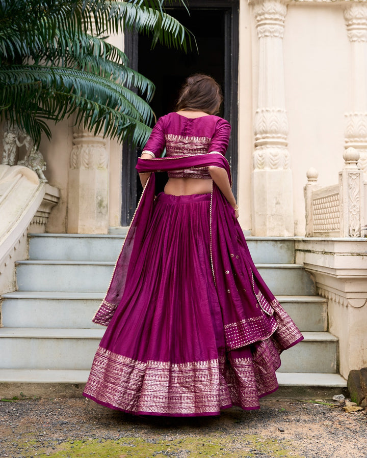 Exquisite Wine Pure Chanderi Plain With Zari Weaving Work Border Lehenga, a timeless piece with stunning zari weaving, embodies the essence of Indian craftsmanship and tradition