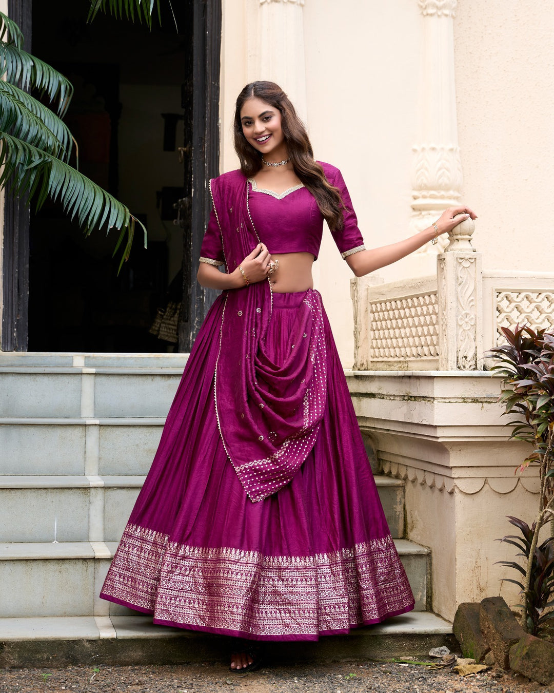 Wine Pure Chanderi Plain With Zari Weaving Work Border Lehenga, a traditional Indian attire, features intricate zari weaving along the border, adding elegance and grace to the outfit