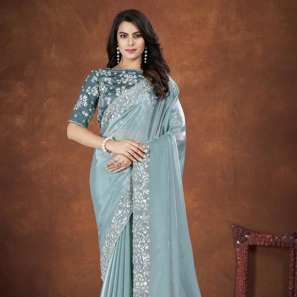 Beautiful turquoise crepe satin silk saree with detailed embroidery and matching stitched blouse