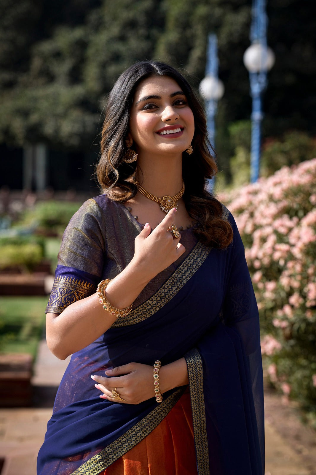 South-style Kanchipuram silk lehenga choli in Orange Color