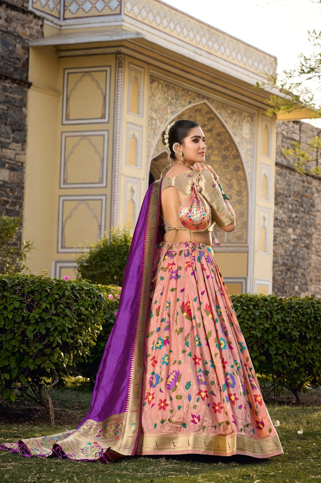 Captivate hearts and turn heads in our Jacquard Silk Paithani Lehenga Choli in Peach Color