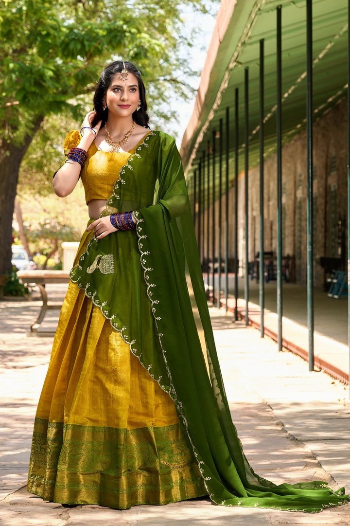 Beautiful yellow Kanjivaram silk lehenga choli with regal design and intricate detailing