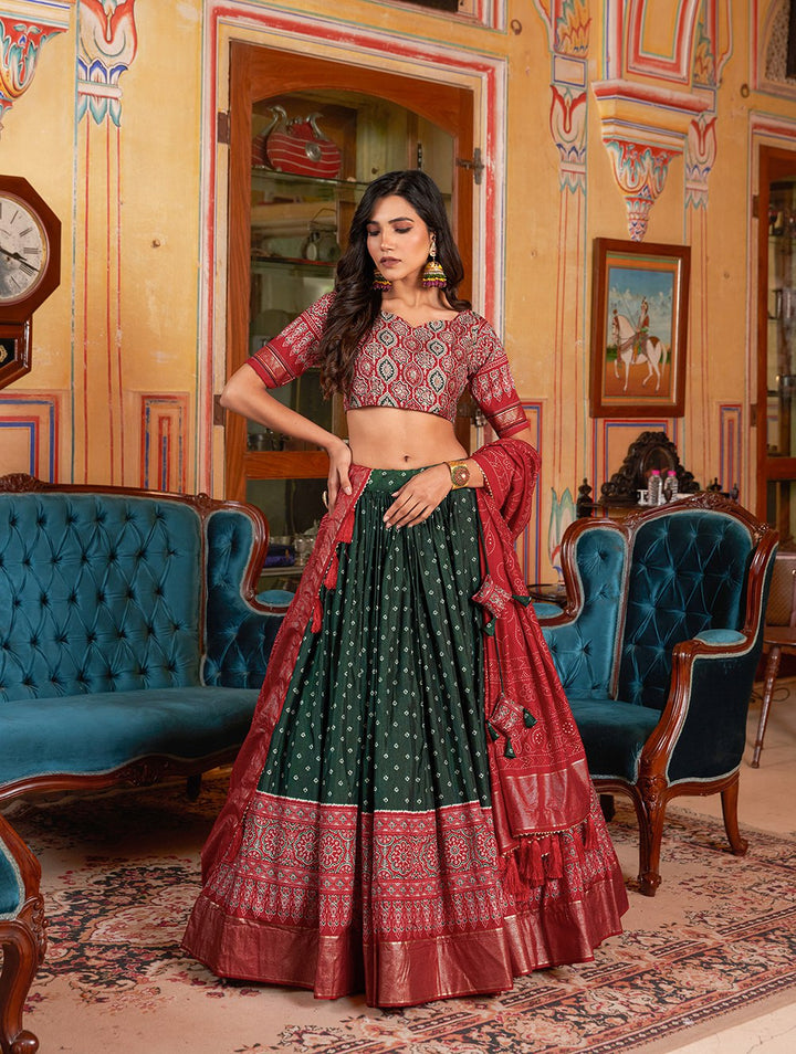 Beautiful bandhani and ajarakh print with intricate foil work on green lehenga choli