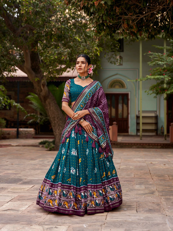 Tussar silk and the mesmerizing allure of ikkat Patola prints lehenga choli in Teal Color