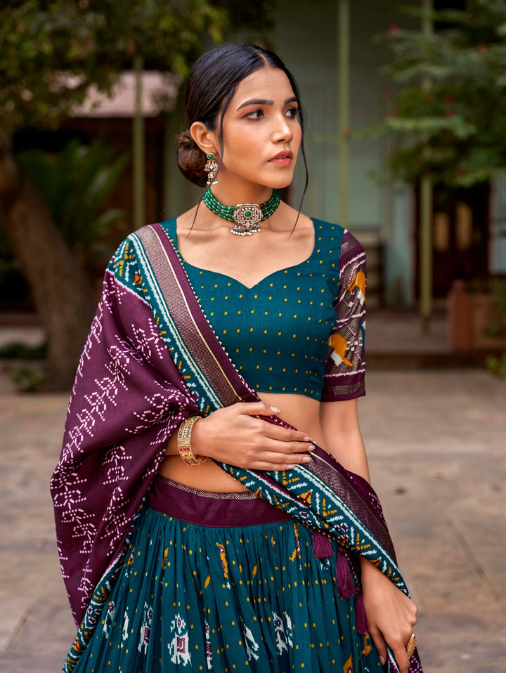 Tussar silk and the mesmerizing allure of ikkat Patola prints lehenga choli in Teal Color