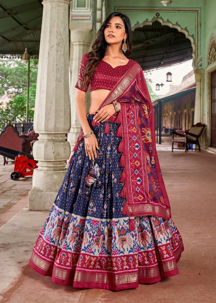 Tussar silk patola print lehenga choli in navy blue color