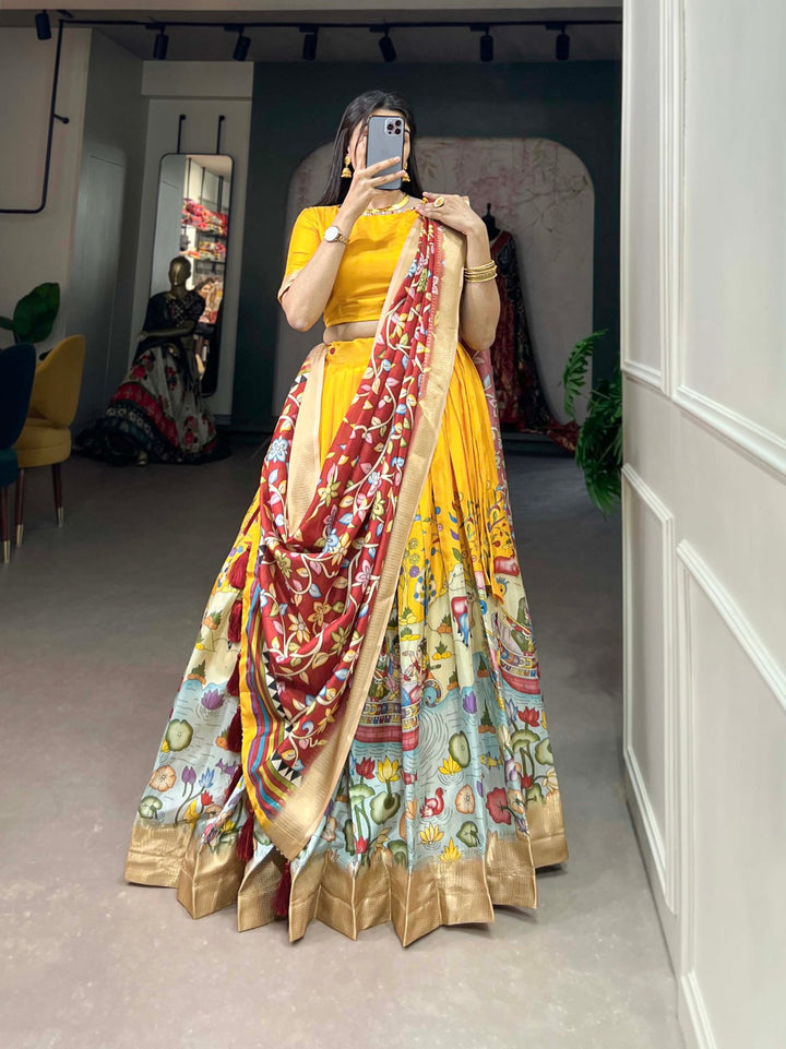 Dola Silk Kalamkari Print With Weaving Border Lehenga Choli In Yellow Color