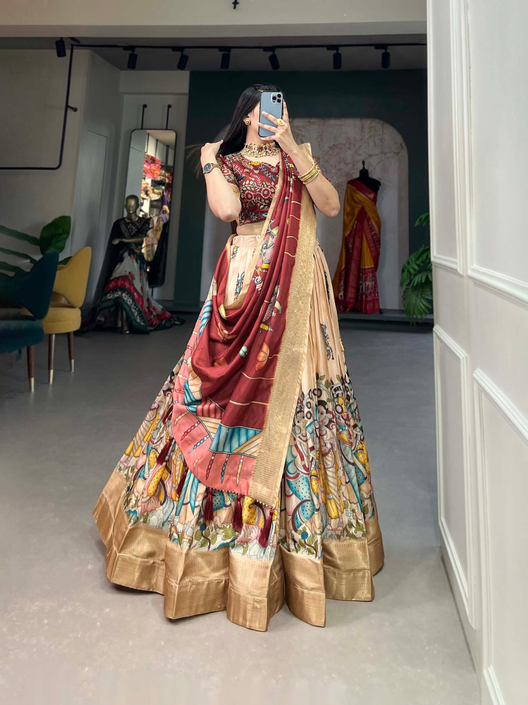 Traditional Indian cream lehenga choli with intricate Kalamkari print