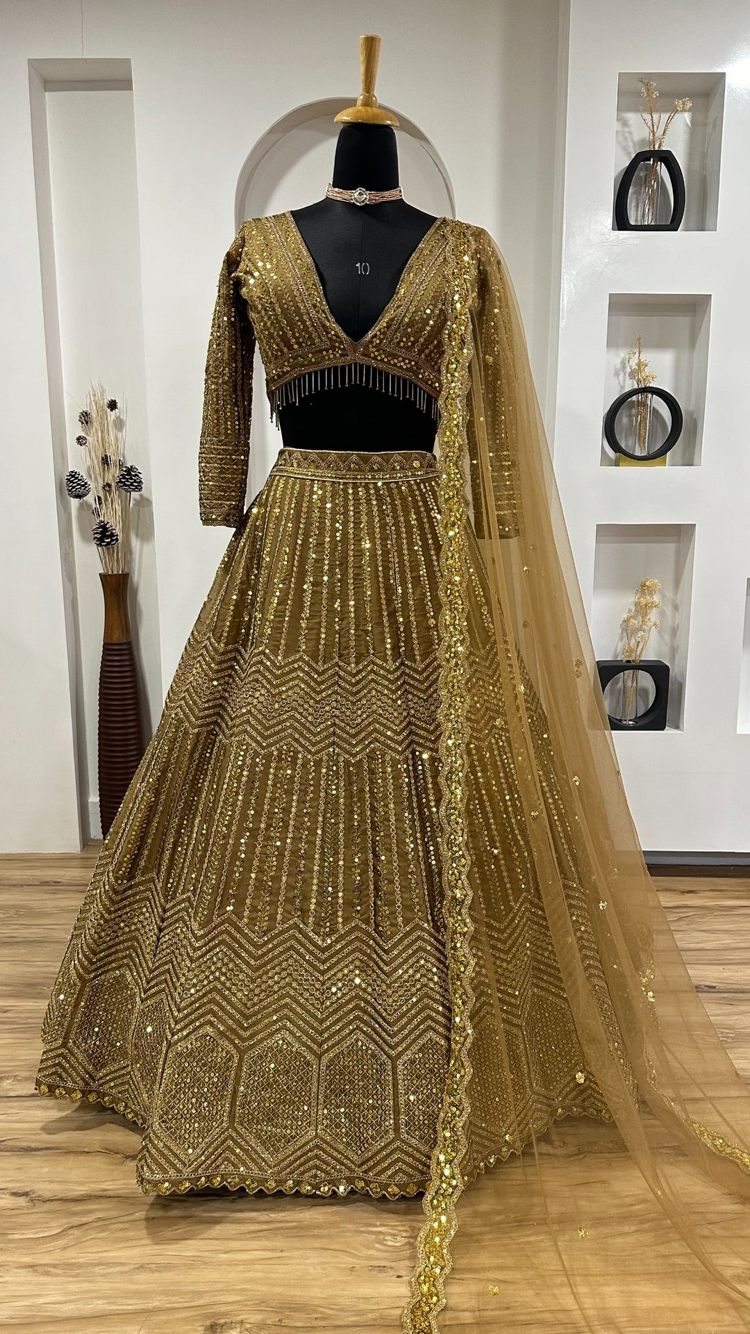 Beautiful golden Kasturi Silk Georgette Lehenga with intricate sequins and dori work