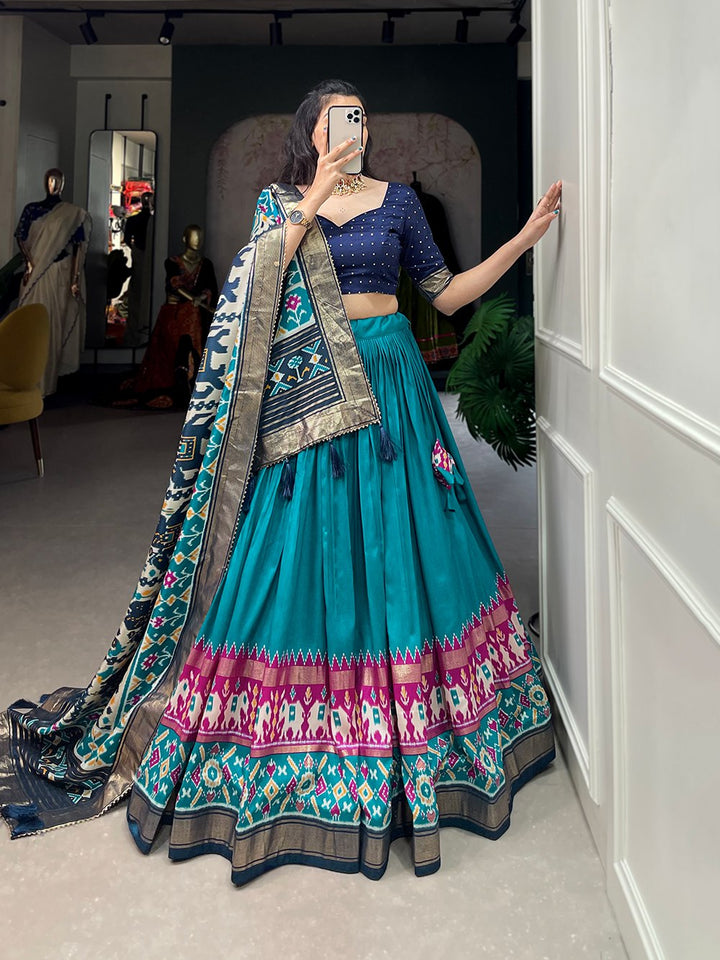 Tussar Silk Patola Print With Foil Work Lehenga Choli In Teal Color