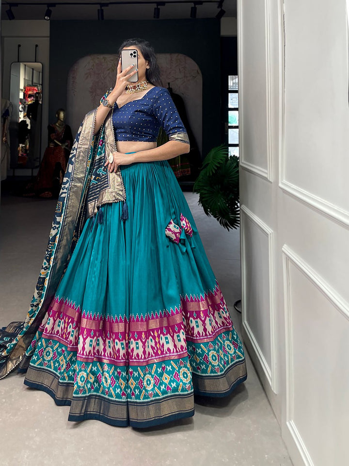 Tussar Silk Patola Print With Foil Work Lehenga Choli In Teal Color