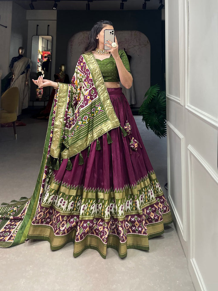 Tussar Silk Patola Print With Foil Work Lehenga Choli In Wine Color