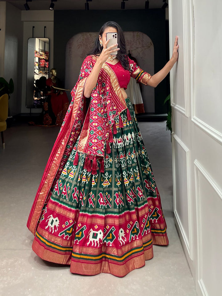 Tussar Silk Patola Print With Foil Work Lehenga Choli In Green Color