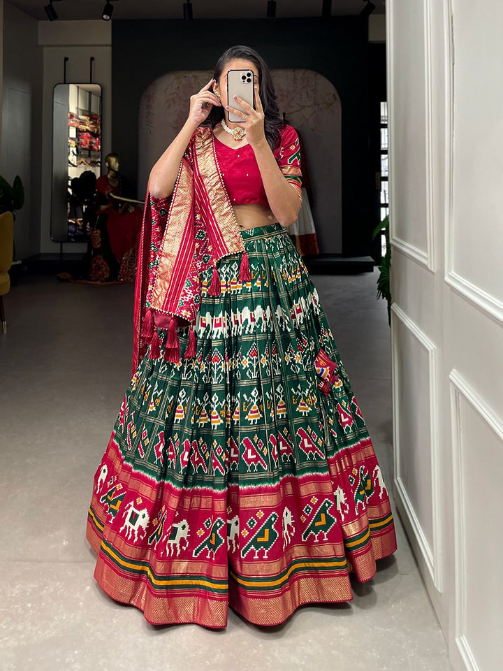 Tussar Silk Patola Print With Foil Work Lehenga Choli In Green Color